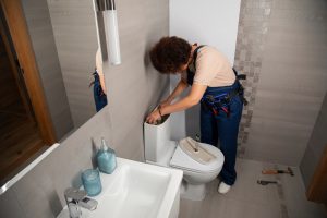 K L Contractor Plumbing Inc | Can I Replace a Toilet Myself? Professional Installation vs DIY in Marietta, GA – KL Plumbing & Construction Female plumber working fix problems client s house 23 2150990728