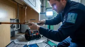 Plumber_shutting_off_burst_pipe_202605262206 Plumber,Plumber in Marietta